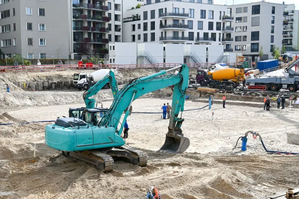 Teal Excavator — Construction Site Teal Excavator — Construction Site